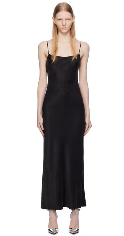 A woman wearing THIRD FORM black lip service bias maxi dress