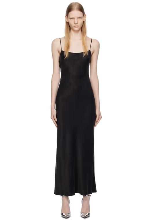A woman wearing THIRD FORM black lip service bias maxi dress