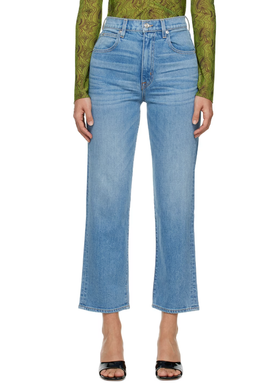 A woman wearing SLVRLAKE blue london crop jeans