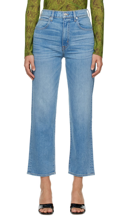 A woman wearing SLVRLAKE blue london crop jeans