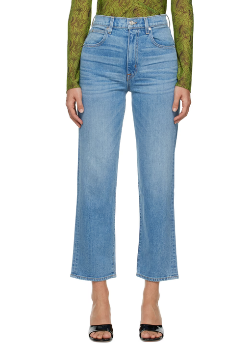 A woman wearing SLVRLAKE blue london crop jeans