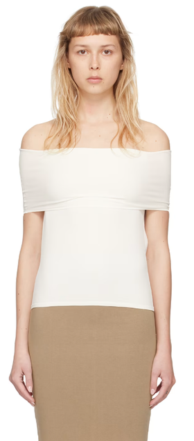 A woman wearing Quira ssense exclusive off-white foldover neck blouse