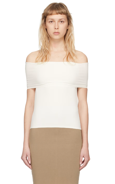 A woman wearing Quira ssense exclusive off-white foldover neck blouse