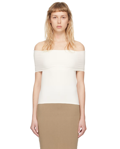 A woman wearing Quira ssense exclusive off-white foldover neck blouse