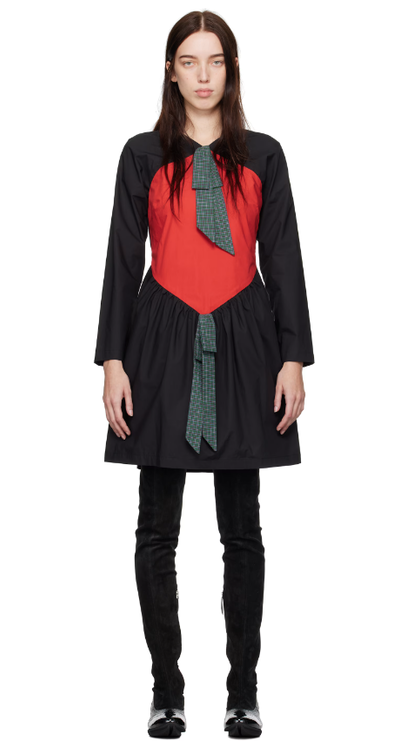A woman wearing SC103 black & red scene minidress