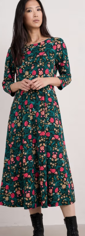 A woman wearing Seasalt Cornwall wild bouquet 3/4 sleeve midi dress