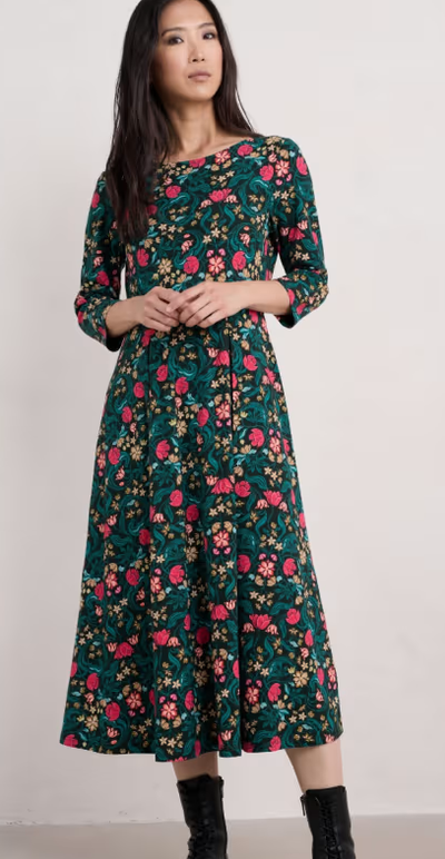 A woman wearing Seasalt Cornwall wild bouquet 3/4 sleeve midi dress