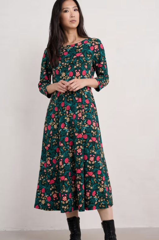 A woman wearing Seasalt Cornwall wild bouquet 3/4 sleeve midi dress
