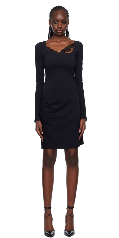 A woman wearing VAILLANT black draped midi dress