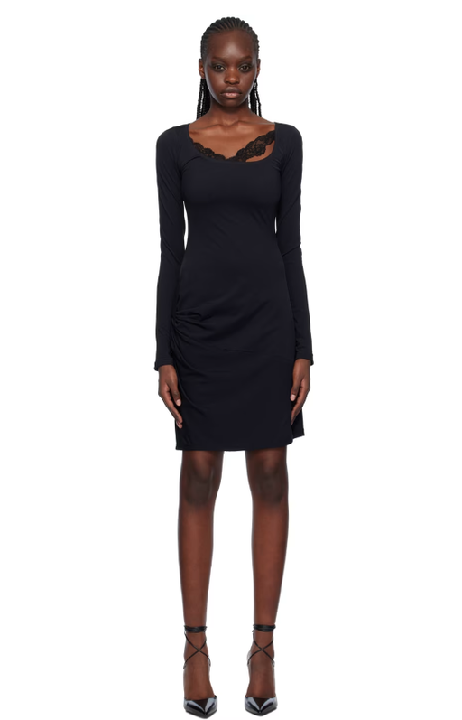 A woman wearing VAILLANT black draped midi dress