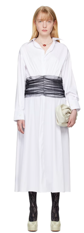 A woman wearing Renaissance Renaissance white drew maxi dress