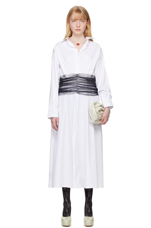 A woman wearing Renaissance Renaissance white drew maxi dress