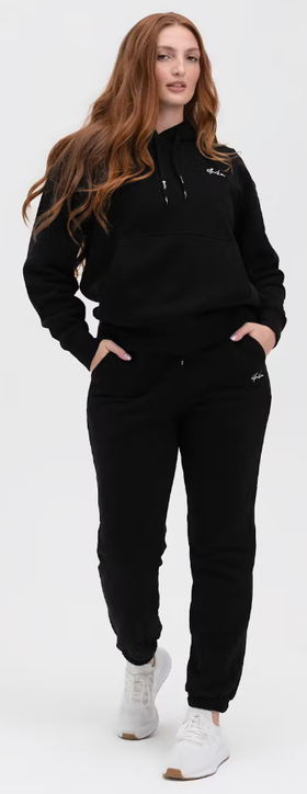 A woman wearing Ethika black womens lifestyle sweatpant