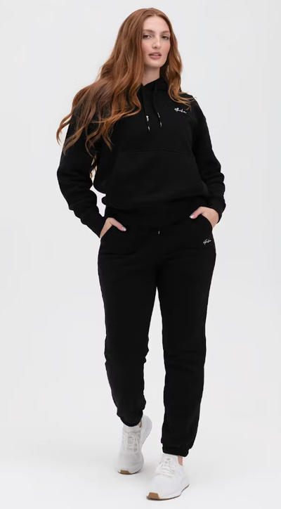 A woman wearing Ethika black womens lifestyle sweatpant