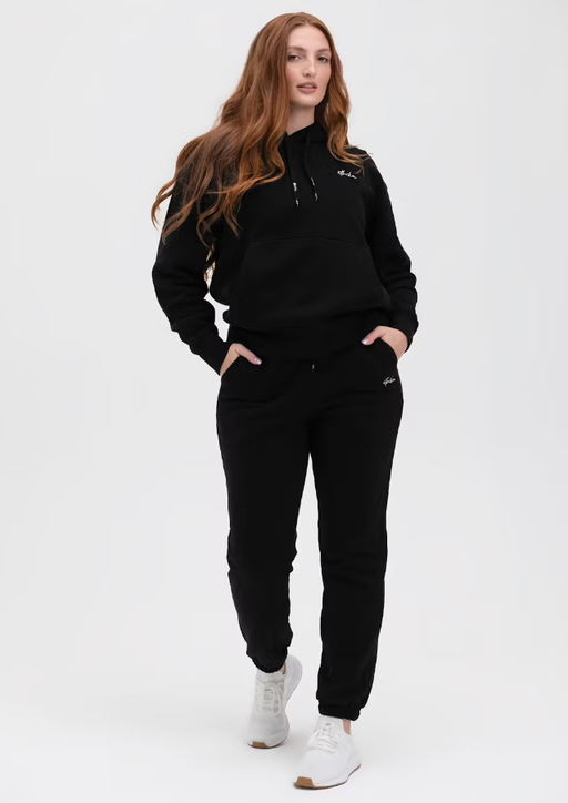 A woman wearing Ethika black womens lifestyle sweatpant