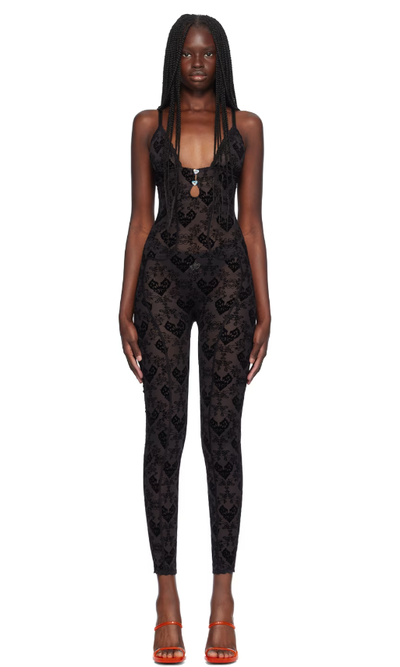 A woman wearing Poster Girl black scarlett jumpsuit
