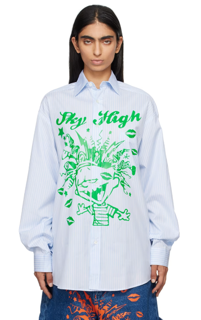 A woman wearing Sky High Farm Workwear blue mindblown print shirt