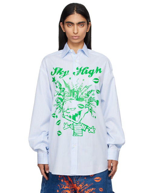 A woman wearing Sky High Farm Workwear blue mindblown print shirt