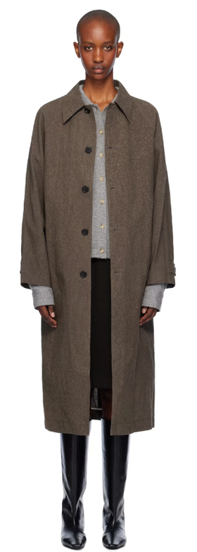 A woman wearing UMBER POSTPAST brown salt dyed cotton long coat