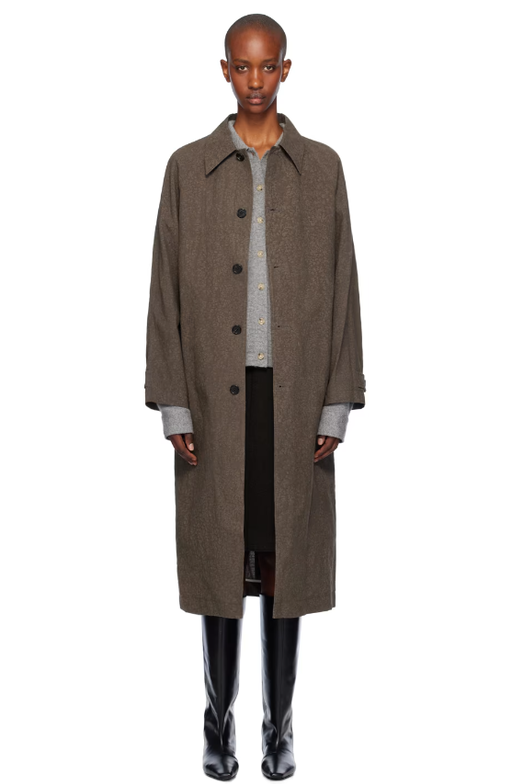 A woman wearing UMBER POSTPAST brown salt dyed cotton long coat