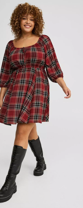 A woman wearing Torrid washable gauze babydoll mini dress