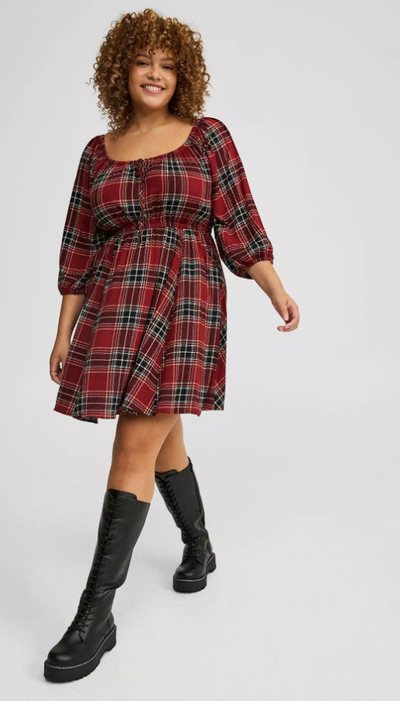 A woman wearing Torrid washable gauze babydoll mini dress