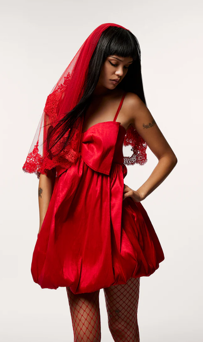 A woman wearing Betsey Johnson​ megan bow dress red