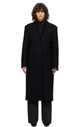 A woman wearing Róhe black opera coat