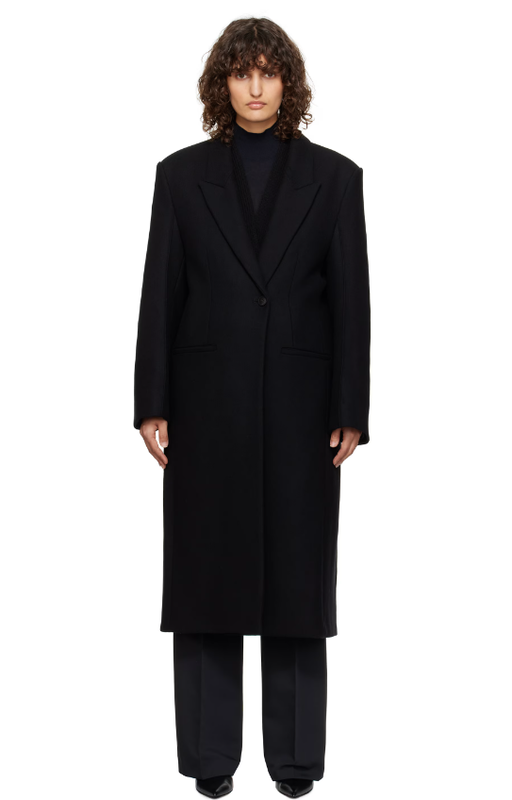 A woman wearing Róhe black opera coat