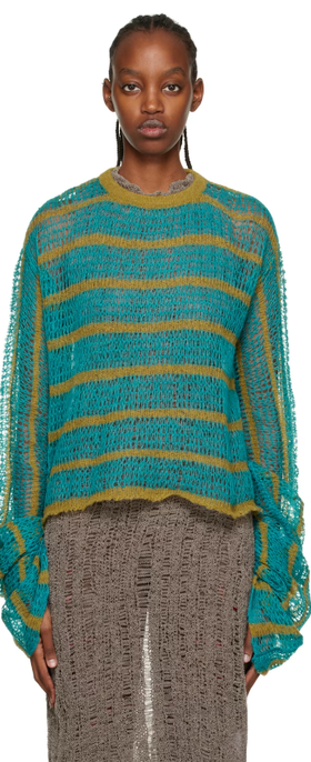A woman wearing VITELLI blue striped sweater