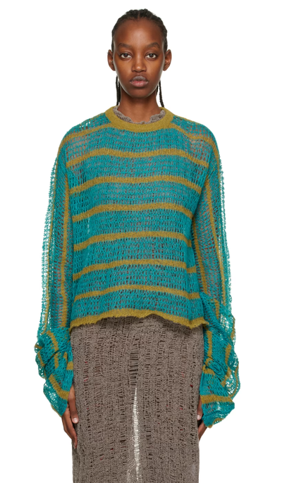 A woman wearing VITELLI blue striped sweater