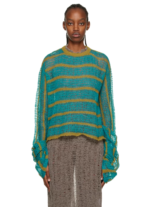 A woman wearing VITELLI blue striped sweater