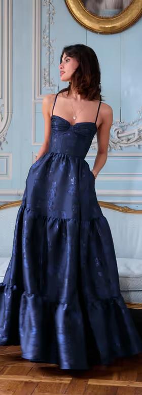 A woman wearing V. Chapman the lucetta dress in navy baroque floral