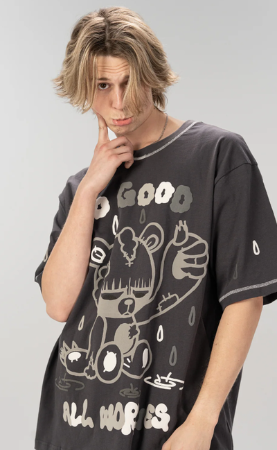 A man wearing cool shirtz​ the all worries tee
