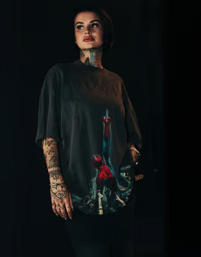 A woman wearing Civil  Regime​ printed black t-shirt