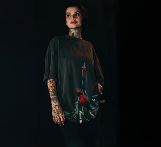 A woman wearing Civil  Regime​ printed black t-shirt