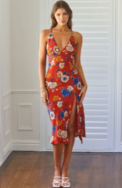A woman wearing Stelly jude midi dress red print red print