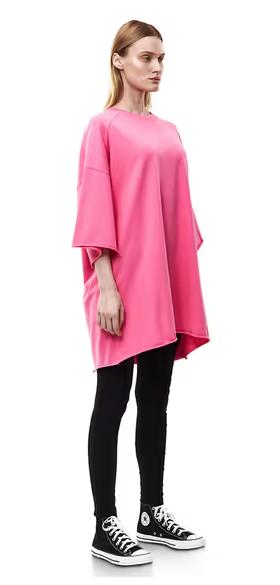 A woman wearing nununu​ women's perfect oversized hot pink t