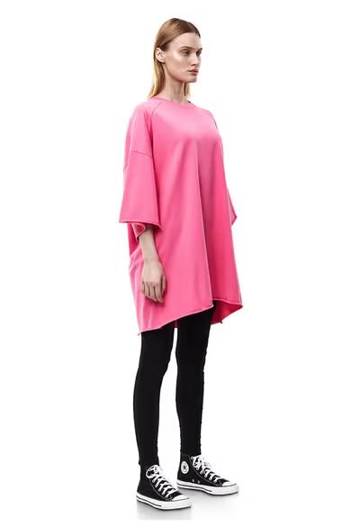 A woman wearing nununu​ women's perfect oversized hot pink t