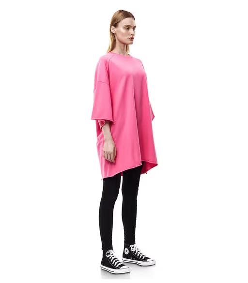 A woman wearing nununu​ women's perfect oversized hot pink t