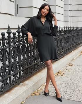 A woman wearing Express collared half button up mini portofino shirt dress