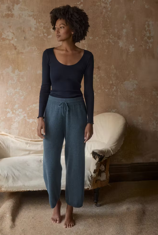 A woman wearing Poetry​ clothing scoop-neck top