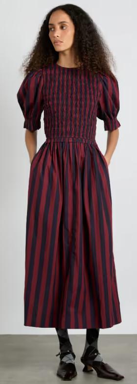 A woman wearing Damson Madder​ bluebelle midi dress - red/navy