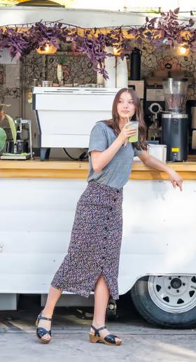 A woman wearing Dansko​ black full grain sandal