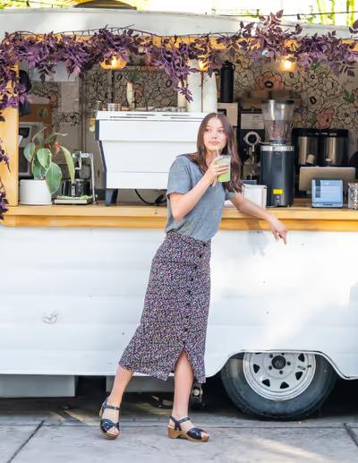 A woman wearing Dansko black full grain sandal