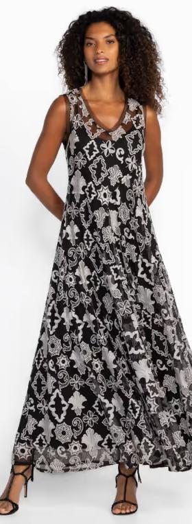A woman wearing Johnny Was​ black mazzy bias dress