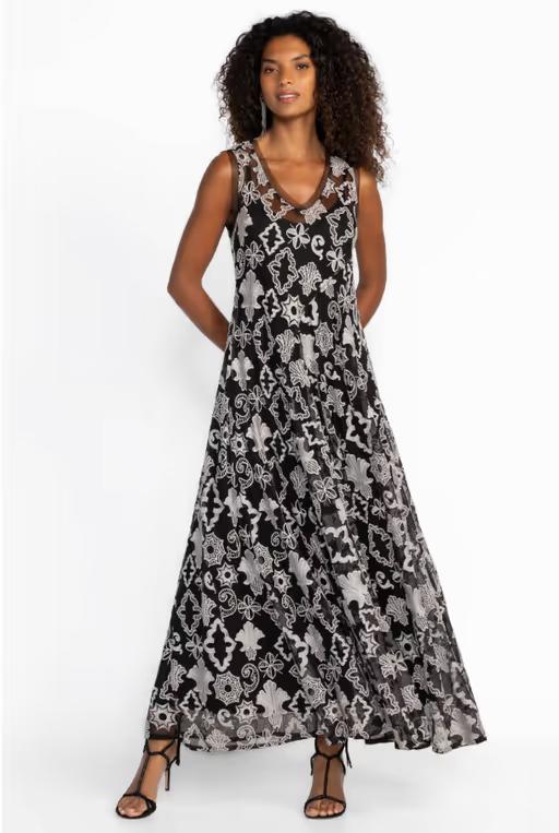 A woman wearing Johnny Was​ black mazzy bias dress