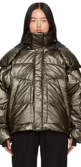 A woman wearing Templa green hyperion os down jacket