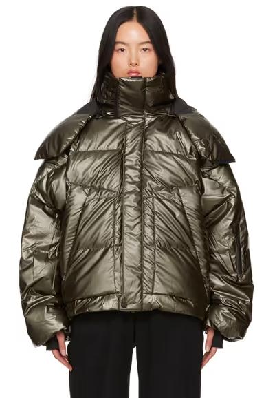 A woman wearing Templa green hyperion os down jacket