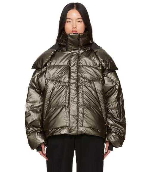 A woman wearing Templa green hyperion os down jacket